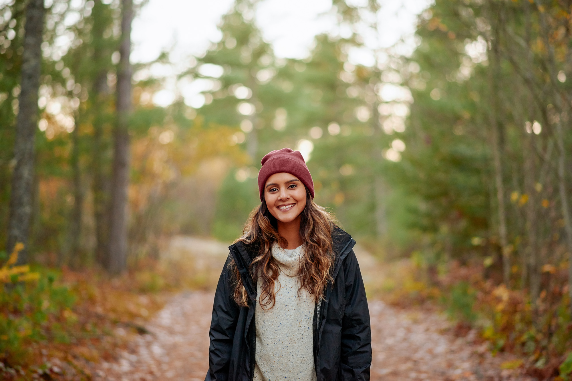Woman Smiling in the Woods