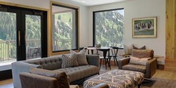 Indoor gathering space with view of mountains