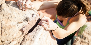 woman rock climbing