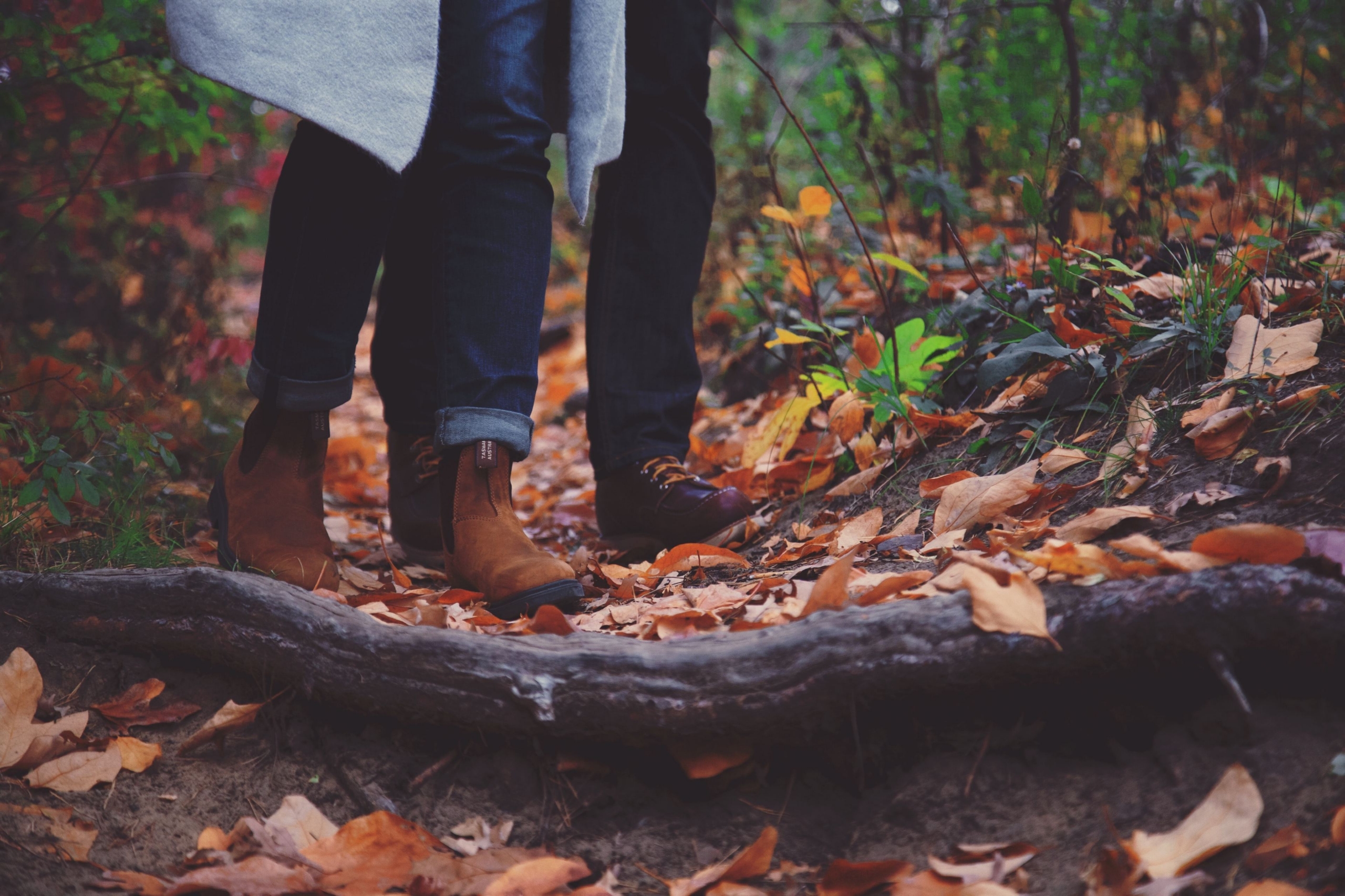 Couple walking in the woods in the fall