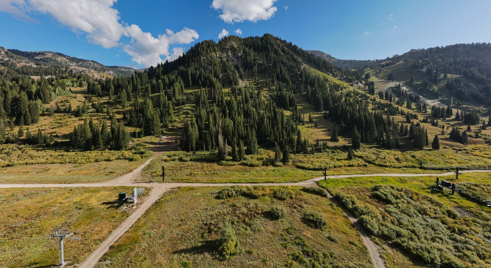 Green summer mountain landscape with hiking trails.